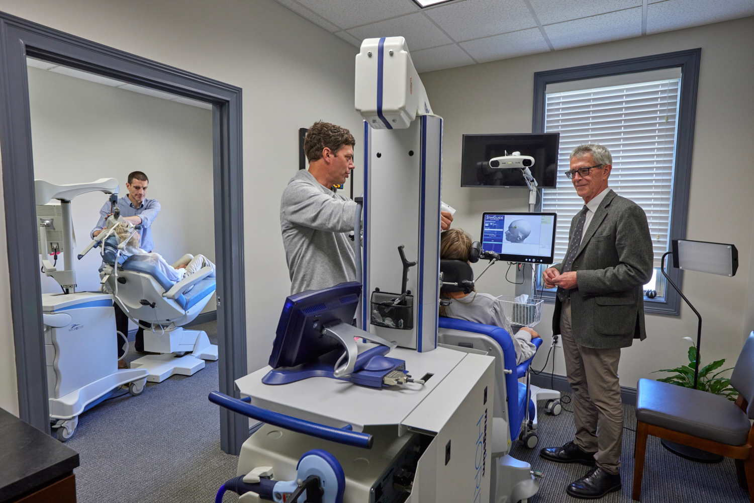 TMS treatment room with physician and patient